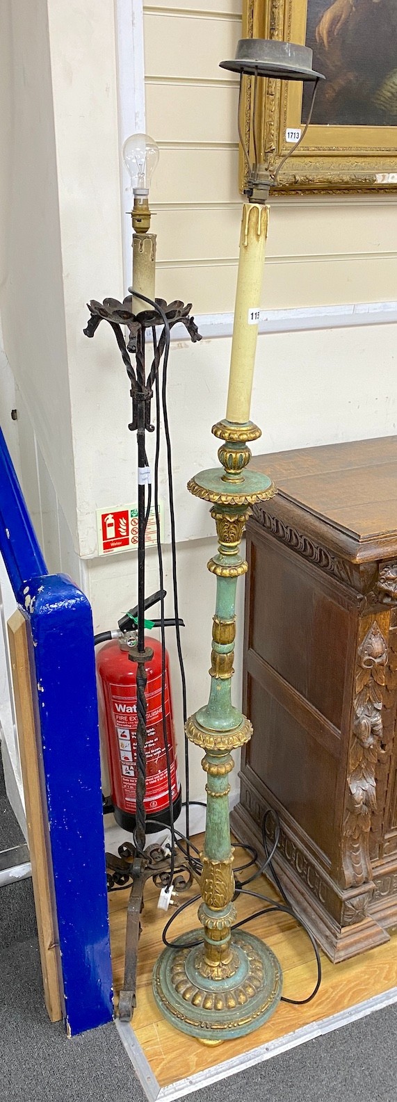 A Victorian style green painted parcel gilt lamp standard together with a wrought iron standard lamp, larger height 156cm